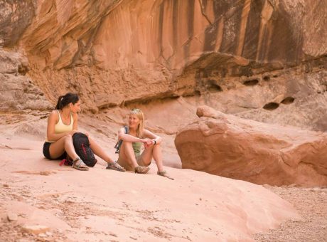 Rock climbers relaxing on boulder